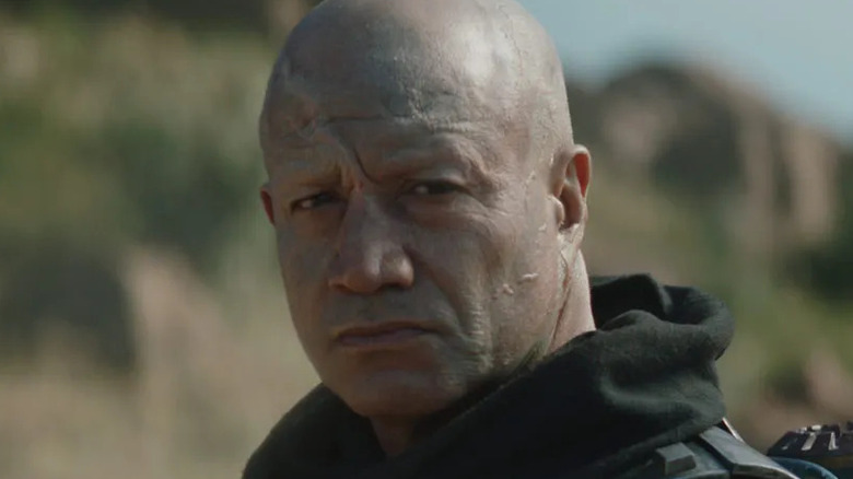 Temuera Morrison outside scowling robe