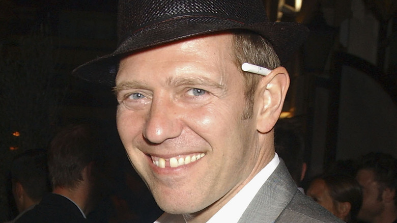 Paul Simonon in hat smiling