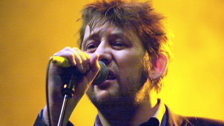 Shane MacGowan singing with Pogues