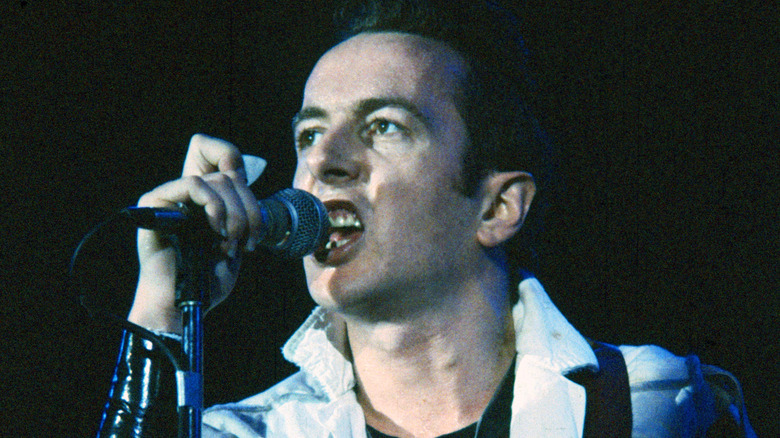 Joe Strummer singing onstage