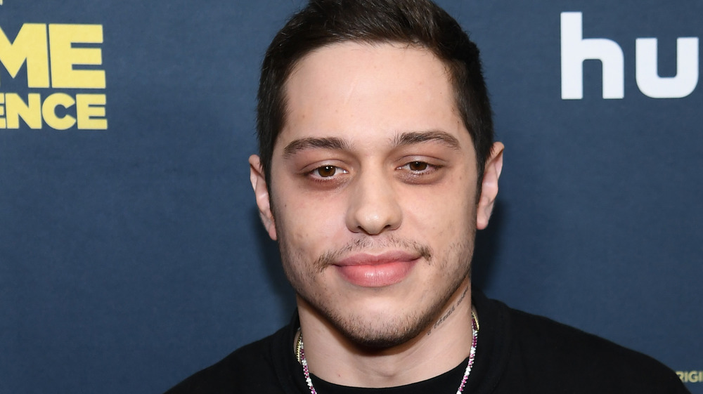 Pete Davidson smirking