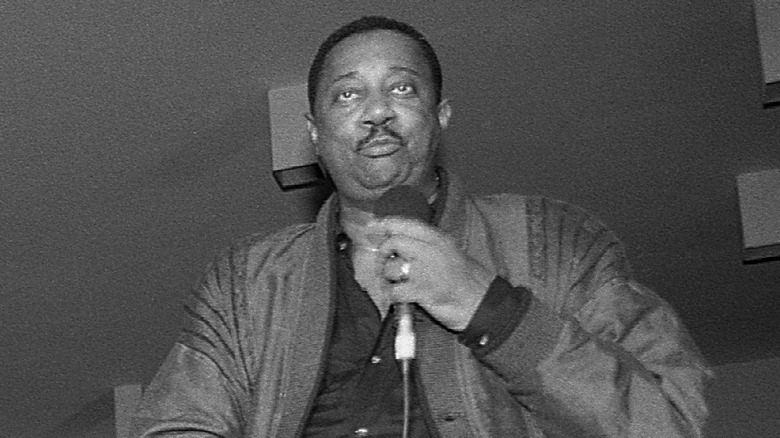 Melvin Franklin holding mic jacket