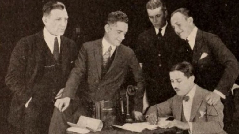 Sam Warner, Frank Griffin, Howard Hawks, and Jack Warner posing