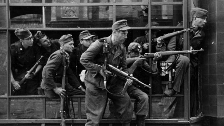 German soldiers standing with guns