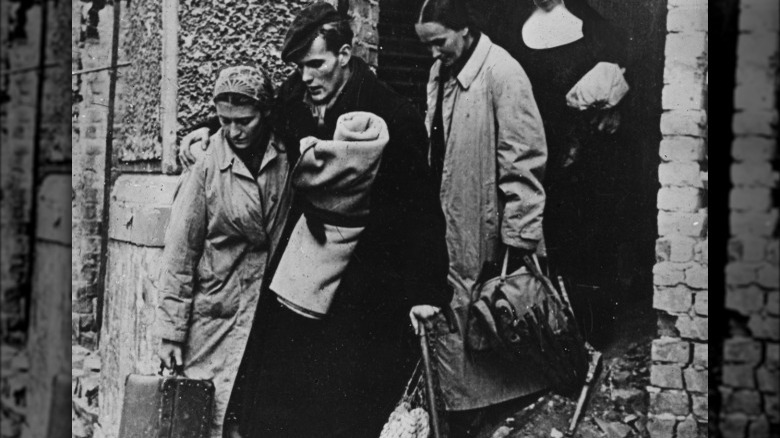 Warsaw refugee family hugging
