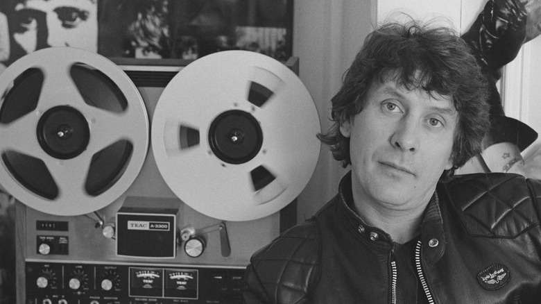 Mickie Most poses beside tape recorder
