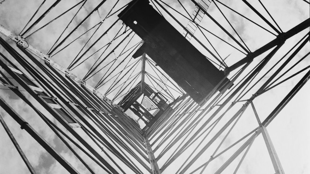 A view upwards inside an oil derrick in the grounds of the Oklahoma State Capitol in Oklahoma City, USA, 1939.