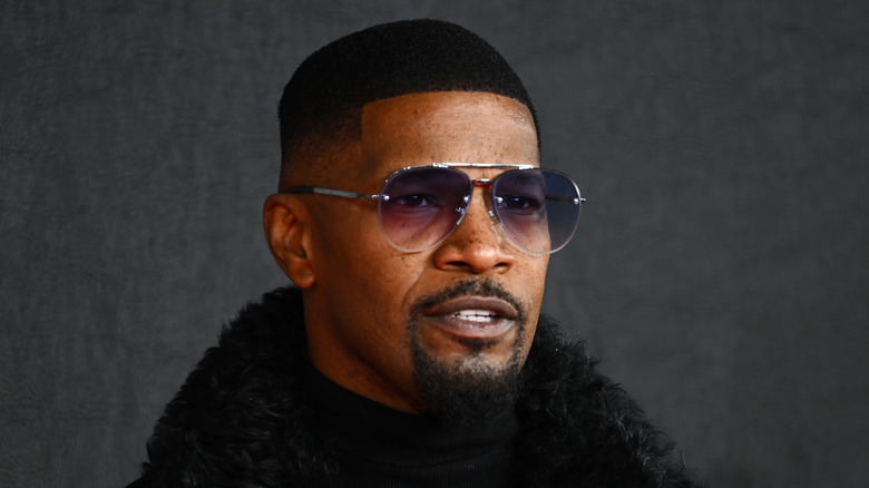 Jamie Foxx black coat sunglasses