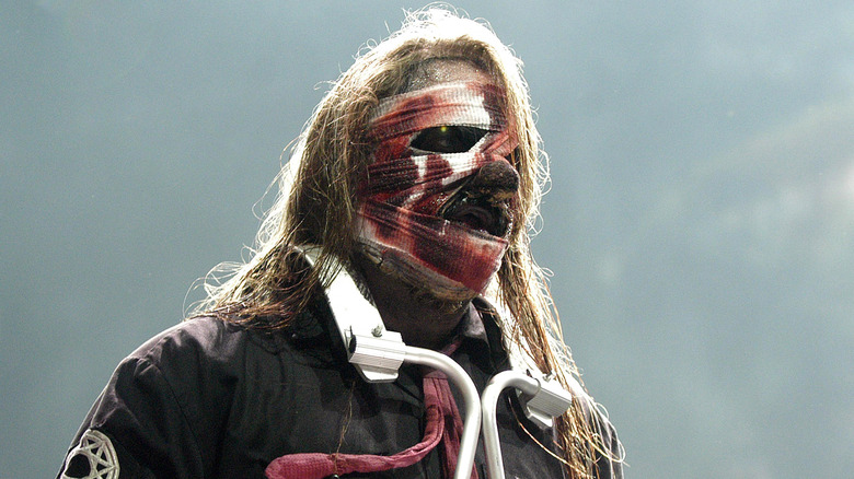 Man wrapped in bloody bandages on stage
