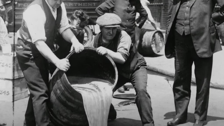 People pouring out keg