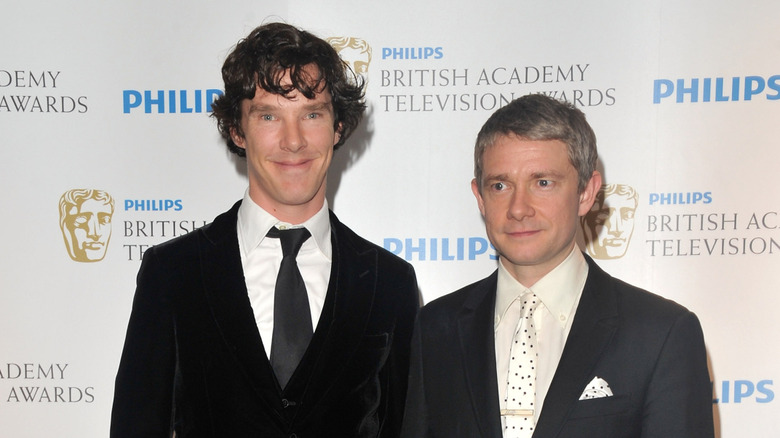 Benedict Cumberbatch grimacing by Martin Freeman smirking