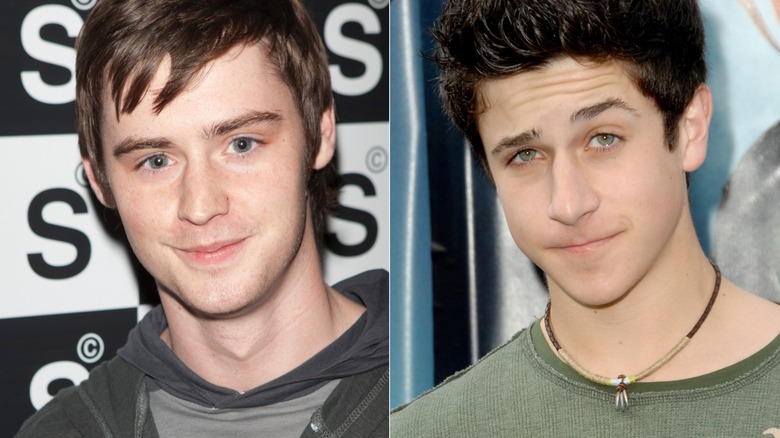 Dan Benson smiling barely in gray hoodie, David Henrie smirking and raising an eyebrow