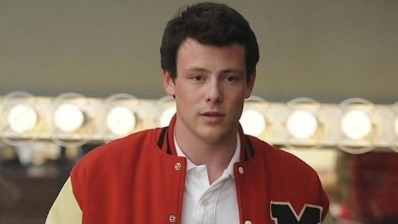 Cory Monteith as Finn Hudson wearing red leatherman jacket on Glee