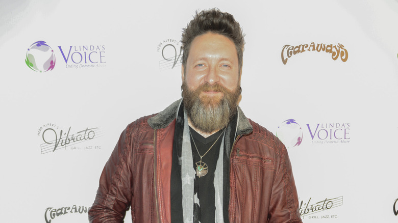 Nolan Neal smiling at camera