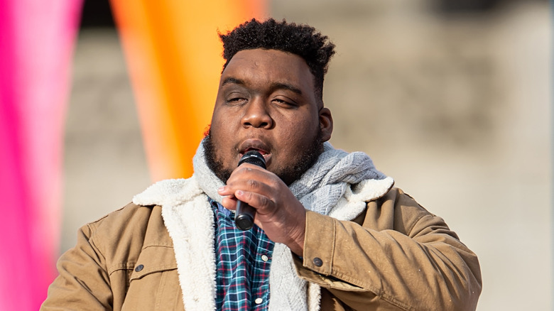 Willie Spence singing on parade float