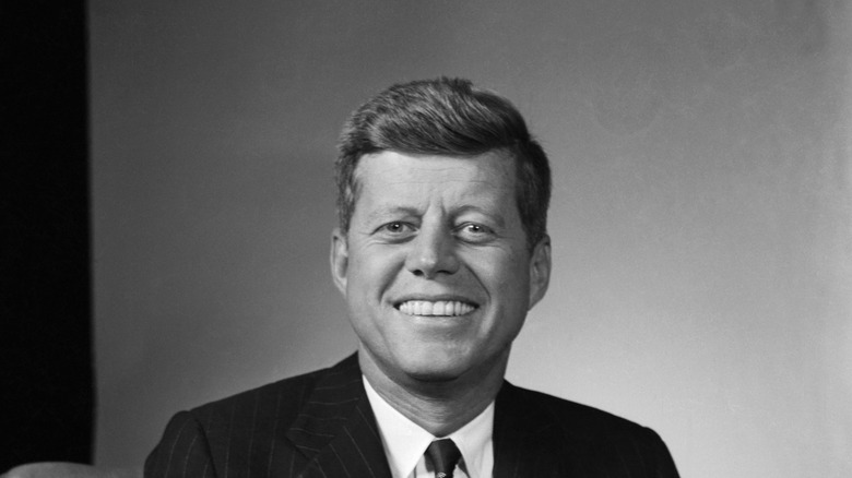 john f kennedy smiling and staring ahead