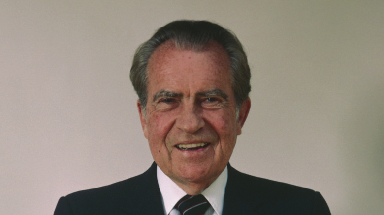 Richard Nixon graying hair laughing at camera