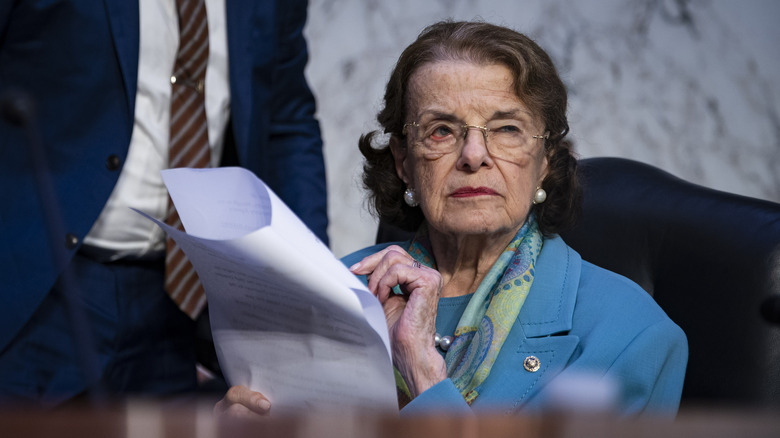 Dianne Feinstein holding a document