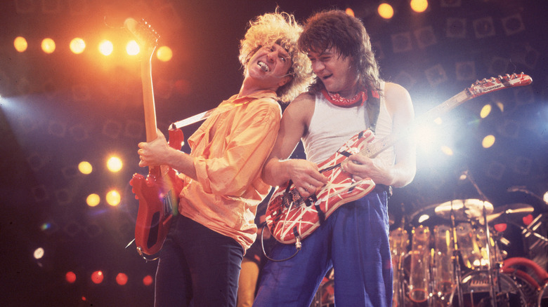 Sammy Hagar and Eddie Van Halen playing guitar onstage