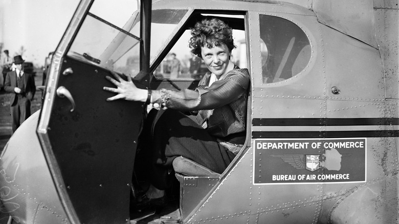 Amelia Earhart sitting in cockpit