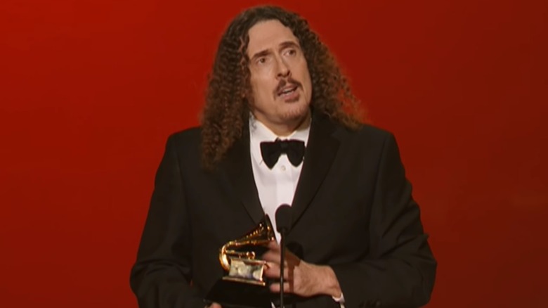 Weird Al Yankovic accepts Grammy Award in speech on stage.