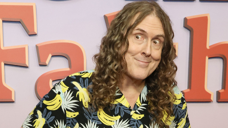 Weird Al Yankovic looks to the side at the premiere of The Simpsons Christmas Special.