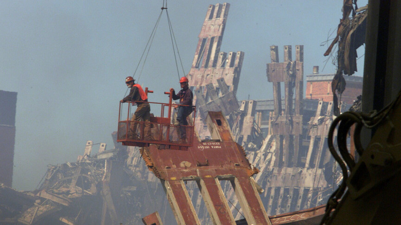 Rescue workers on plinth amid 9/11 rubble