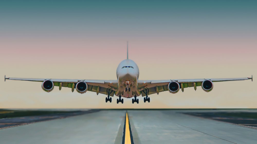 Plane landing on runway