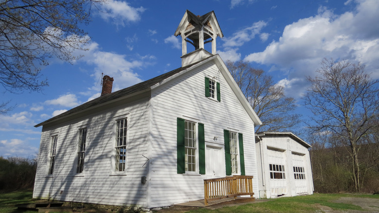 White wooden house with belltower exterior