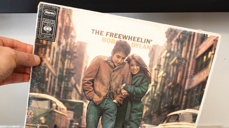 Hand holding The Freewheelin' Bob Dylan album