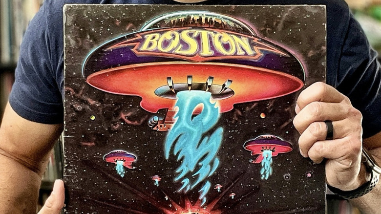hand holding Boston self-titled album cover