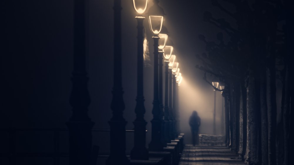 Man walking a dark street