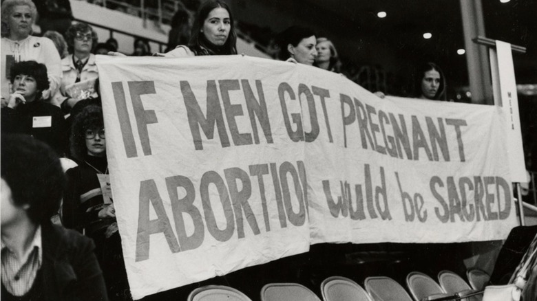 pro abortion protest women holding sign