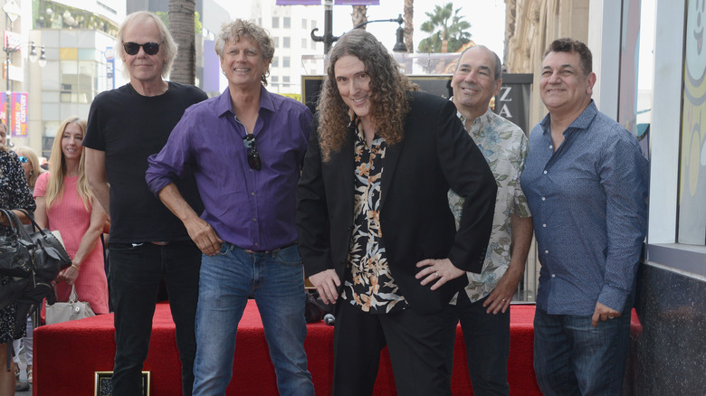 Al Yankovic posing with his band in 2018