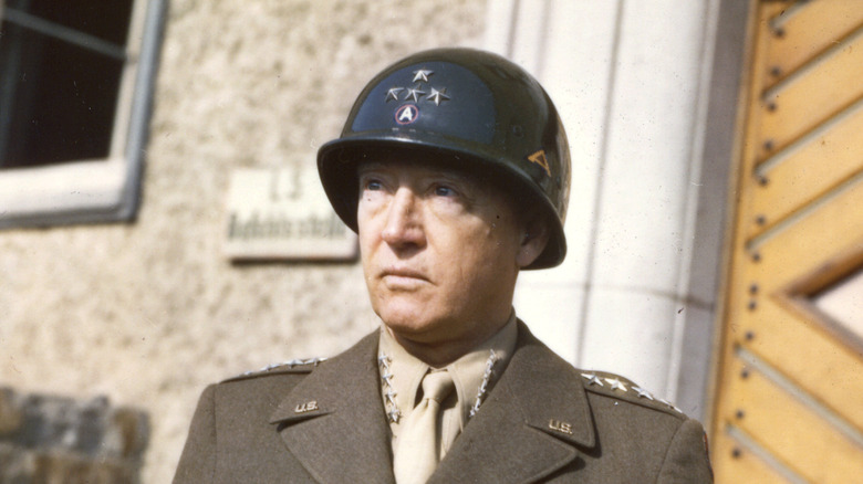 General George Patton in uniform and a helmet