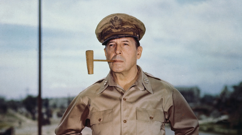 General Douglas MacArthur posing with his corncob pipe