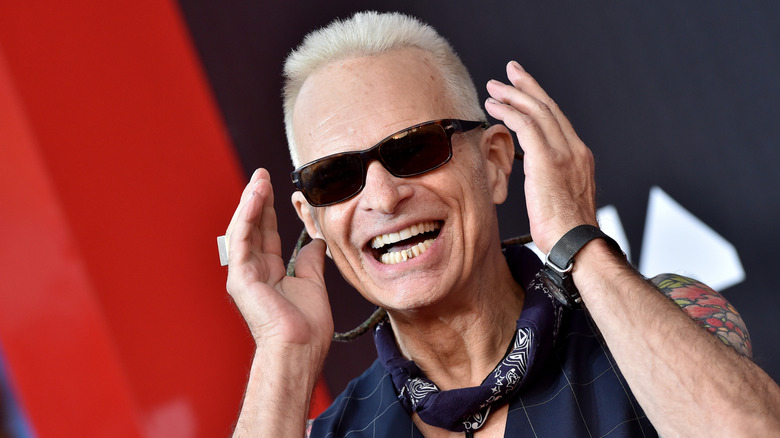 David Lee Roth gesturing with both hands at an event