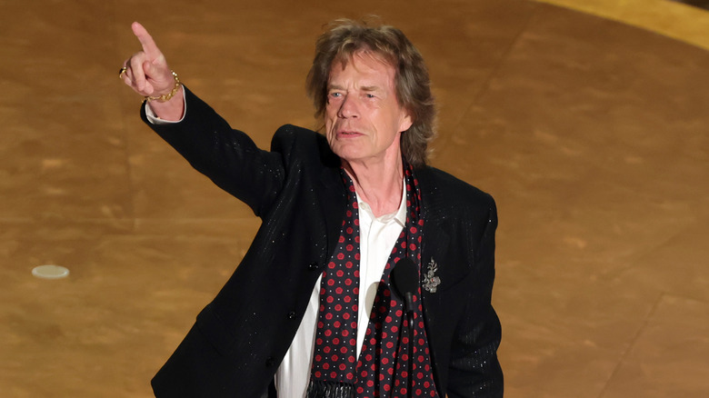 Mick Jagger onstage pointing out to the crowd