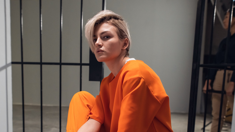 Female prisoner in cell