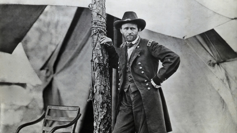 Ulysses S. Grant leaning up against a tree