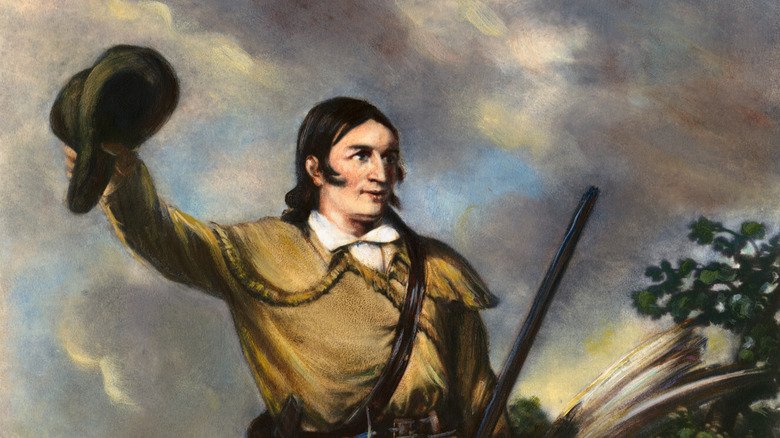 Davy Crockett holding a rifle