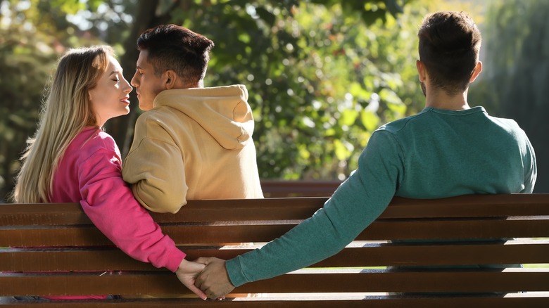 three people on bench