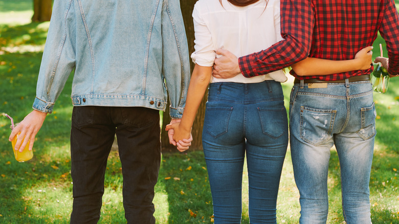 three people with backs turned