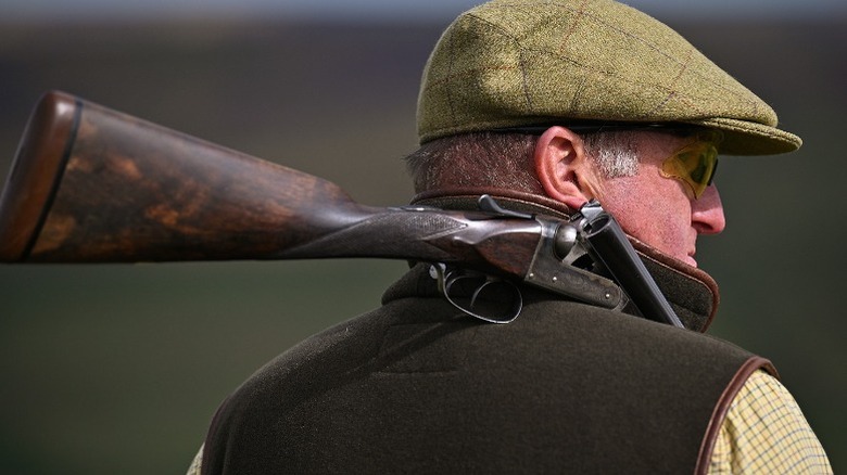 man with shotgun