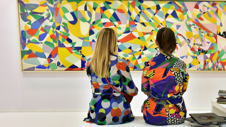 Guests observing artwork