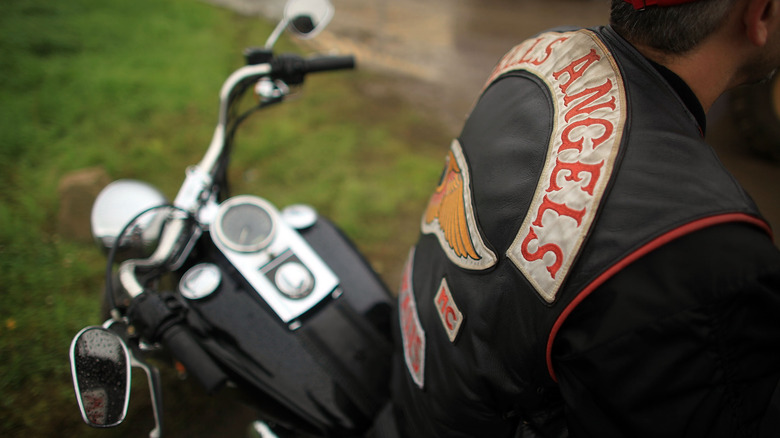 dude in Hells Angels vest on a hog