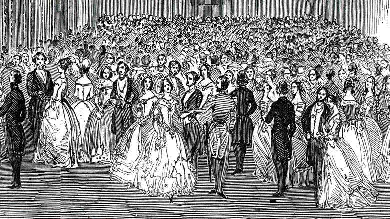 Couples dancing in Victorian ballroom