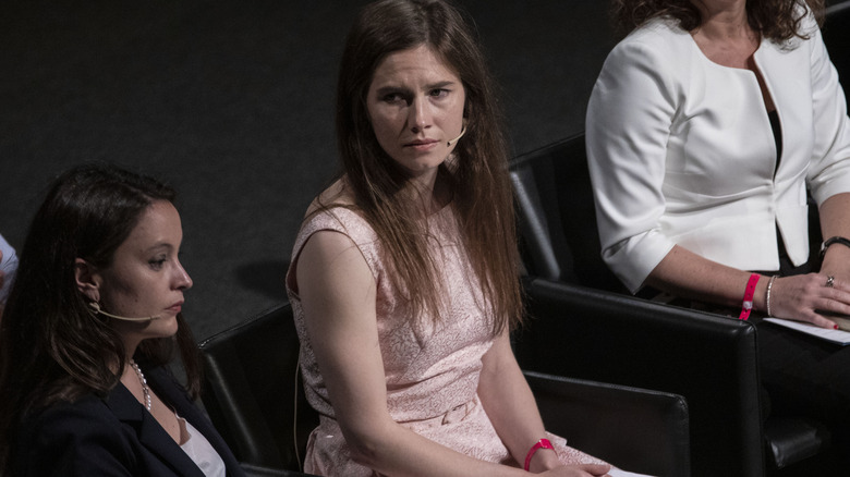 Amanda Knox sits on panel
