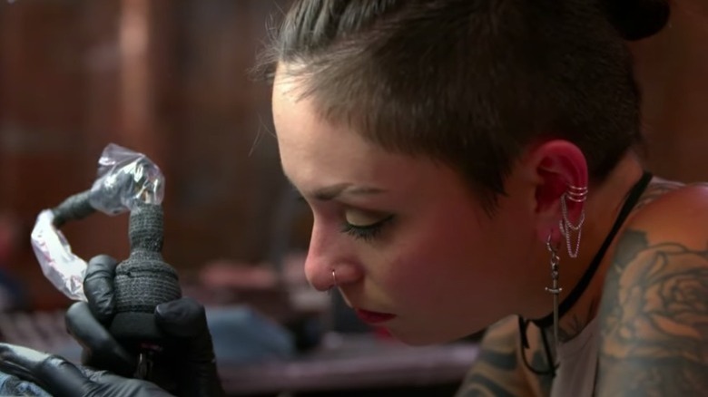 Angel Rose creates a tattoo