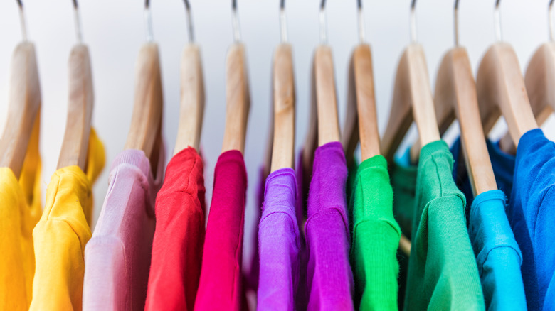 colored shirts on a rack